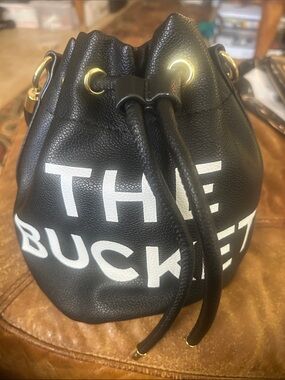 Black Drawstring Bucket Hobo Bag with White Lettering